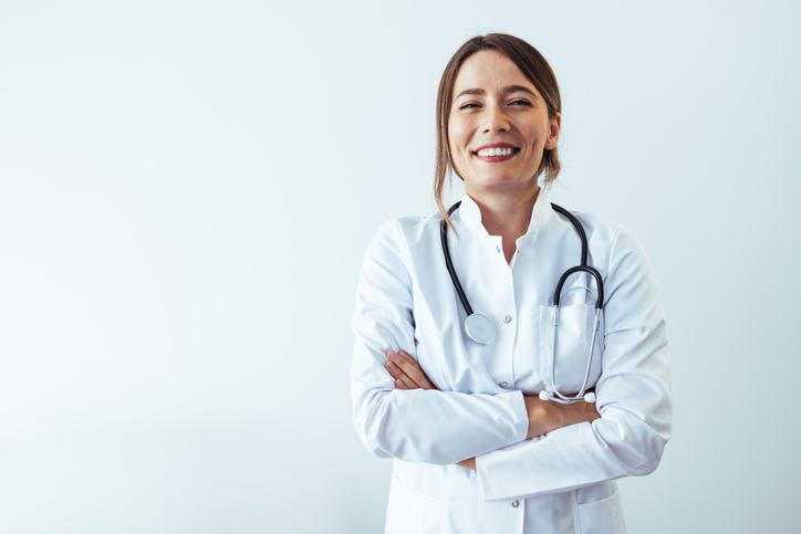 Successful female doctor isolated on white background